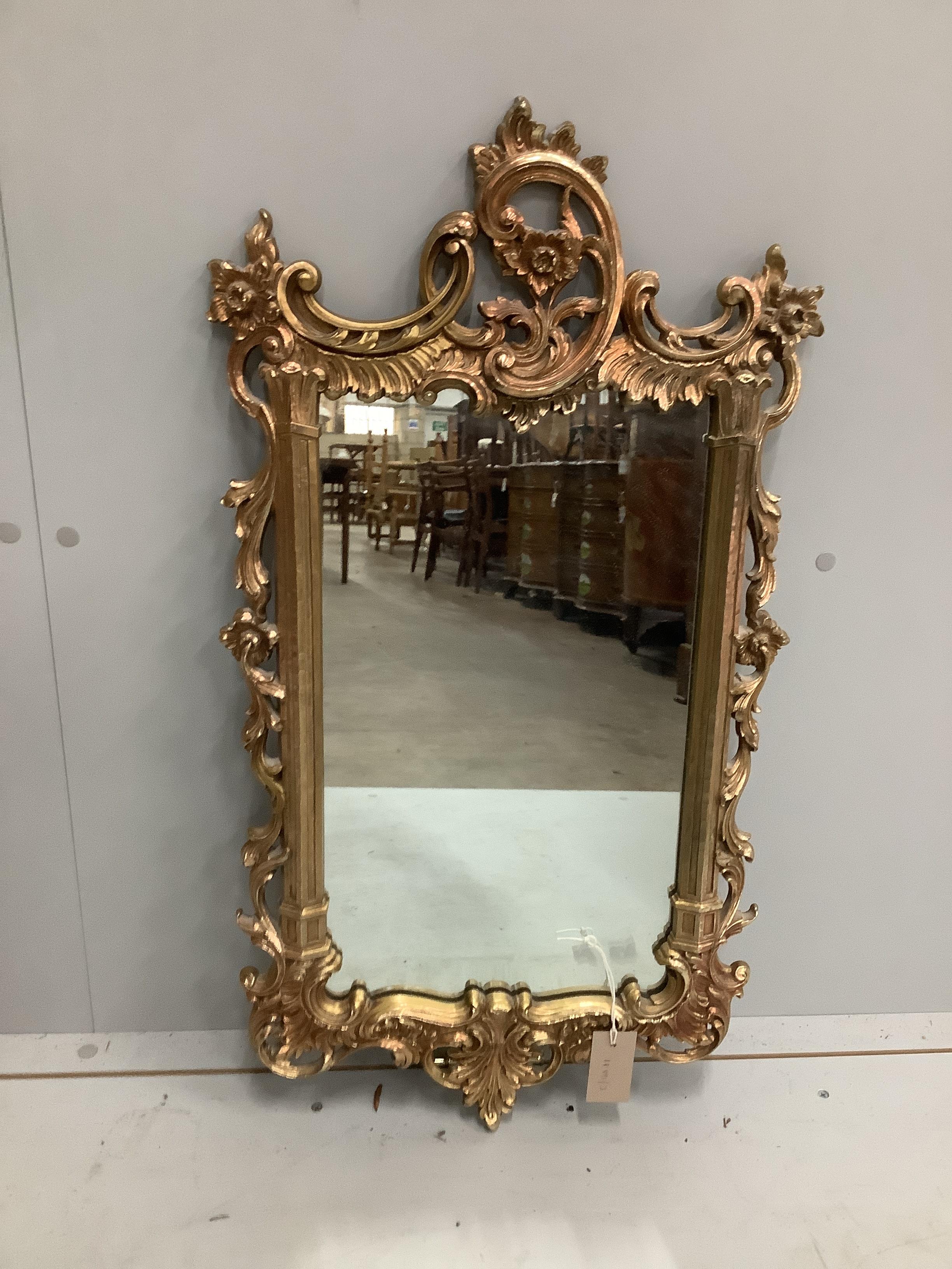 An 18th century style gilt composition wall mirror, width 43cm, height 78cm